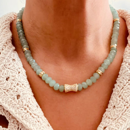 beaded necklace with green Aventurine beads and small gold-toned spacer accents, paired with a cream crochet top.
